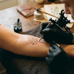 Tattoo tip calculator — how much to tip a tattoo artist per session