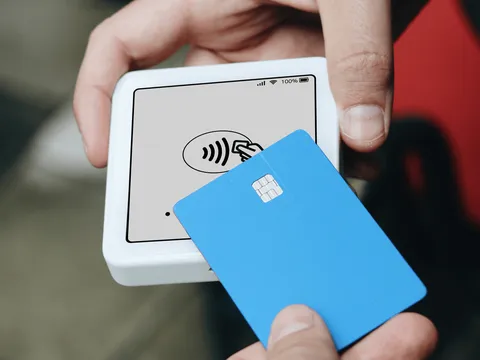 Customer paying by card at a point-of-sale screen that prompts for a tip
